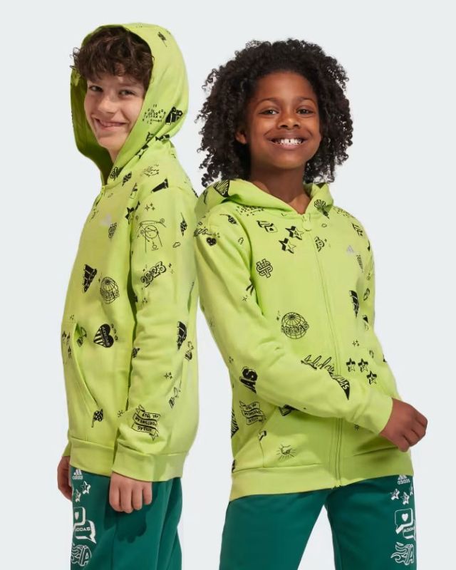 Prodotto: ADIDAS - HOODIE BRAND LOVE ALLOVER PRINT FULL-ZIP JUNIOR - IA1556
