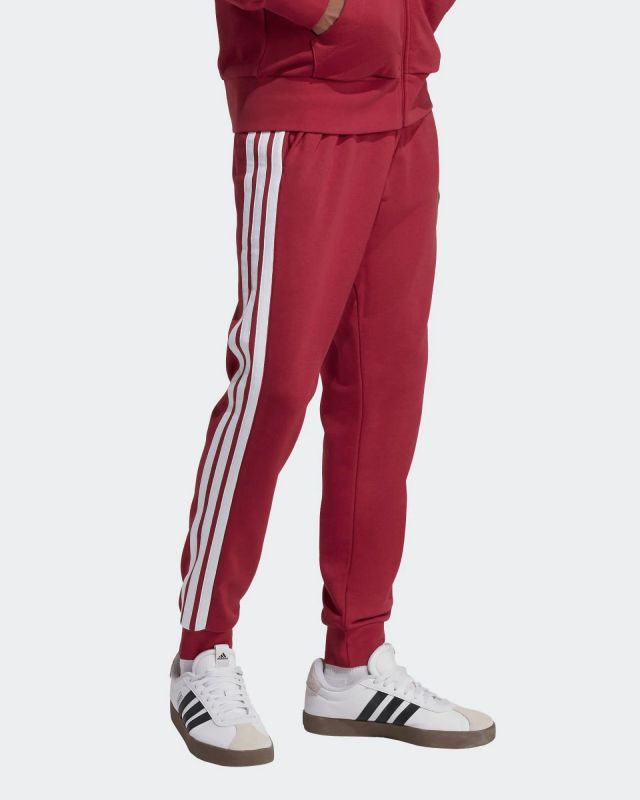 Prodotto: ADIDAS - PANTALONE ESSENTIAL ROSSO DA UOMO 3 STRISCE - KR2702
