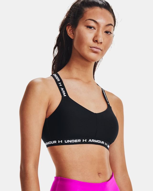 Prodotto: UNDER ARMOUR - Top nero ultra aderente in tessuto traspirante con banda logo bianca