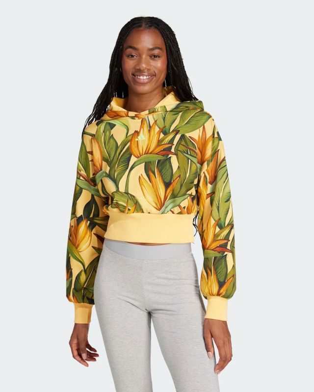 Prodotto: ADIDAS - FELPA DONNA CON CAPPUCCIO FANTASIA TROPICALE GIALLA, VERDE, MARRONE E NERA, X FARM -  JD6282